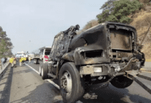 a burned out truck on the road